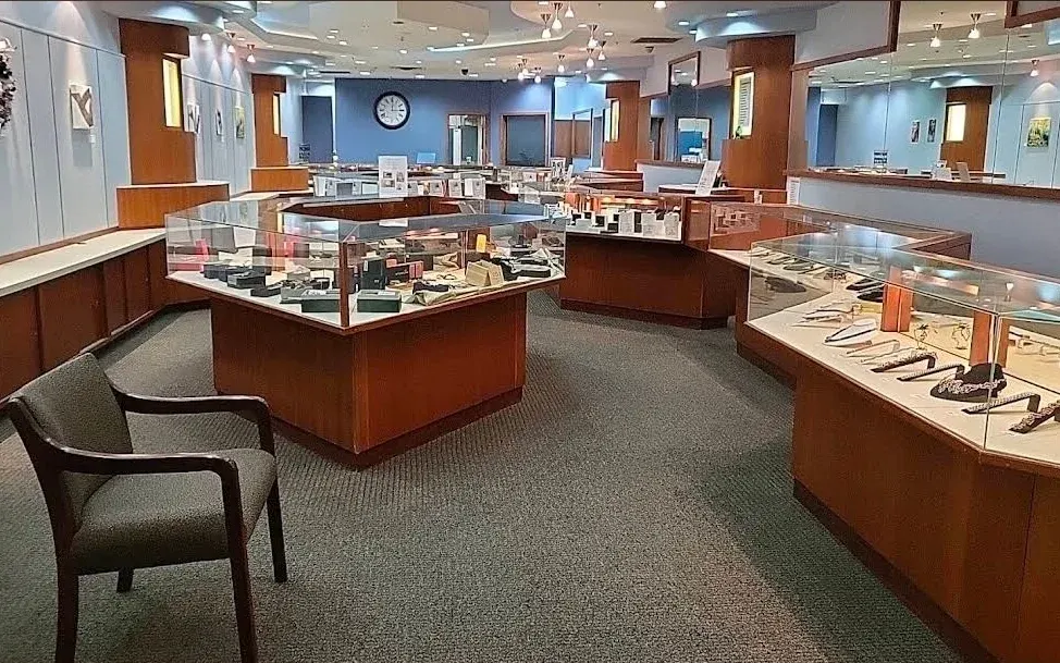 The Watch ProShop showroom with lit display cases inside Valley West Mall, West Des Moines.